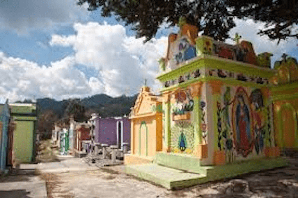 Cemetary at Chichicastenango is full of colorful tombs.