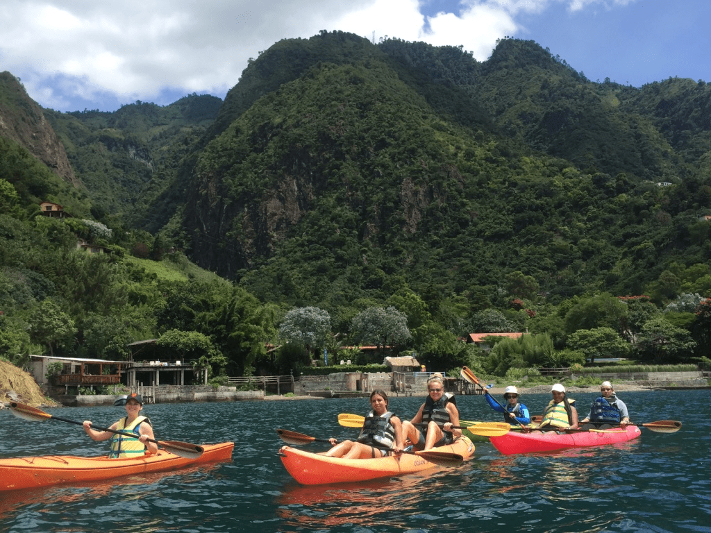 kayaking with Santa Cruz la Laguna in the background.