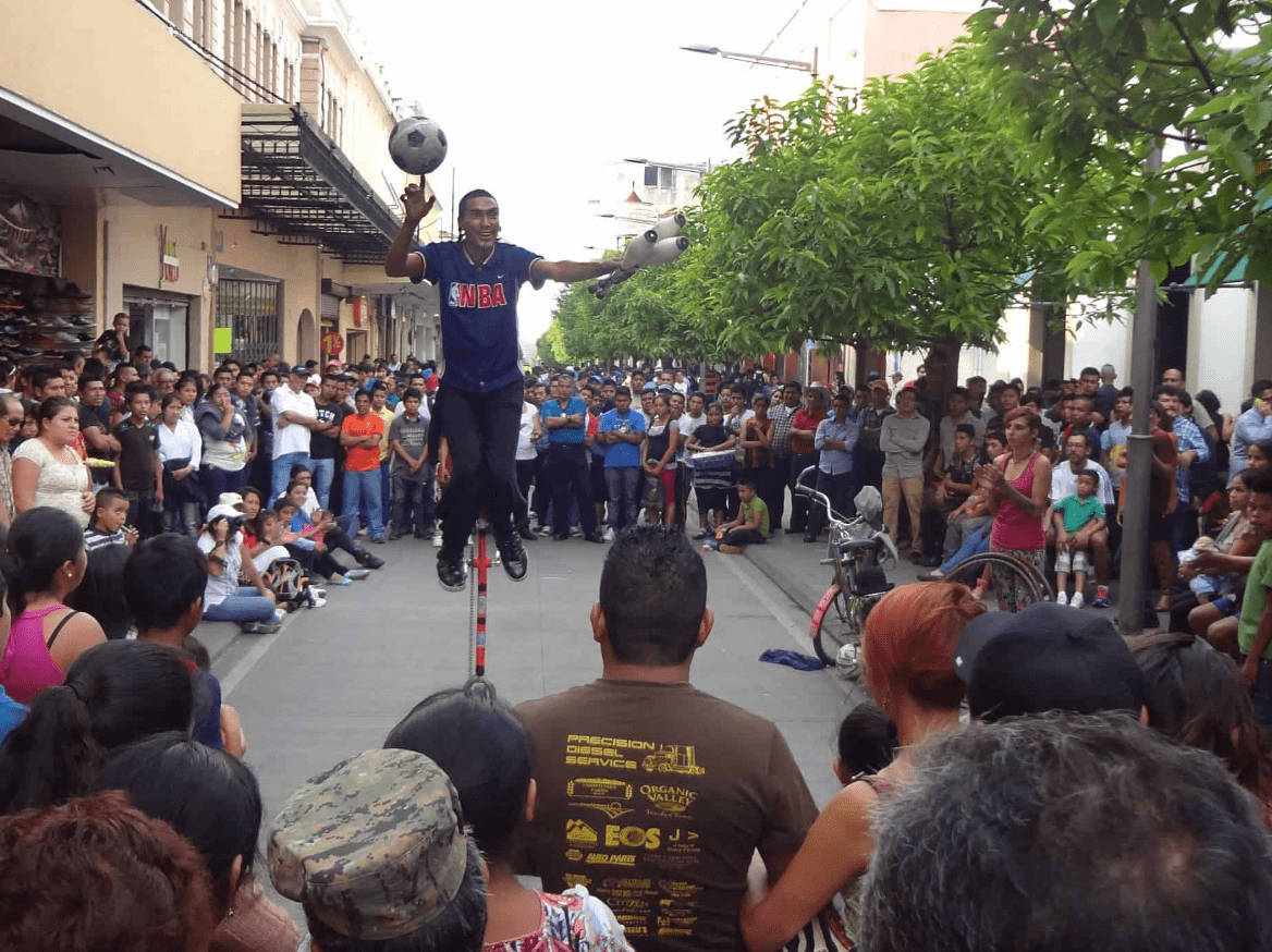 A street performer draws crowds in Zone 1 Guatemala City.  This area is included in any day tour. 