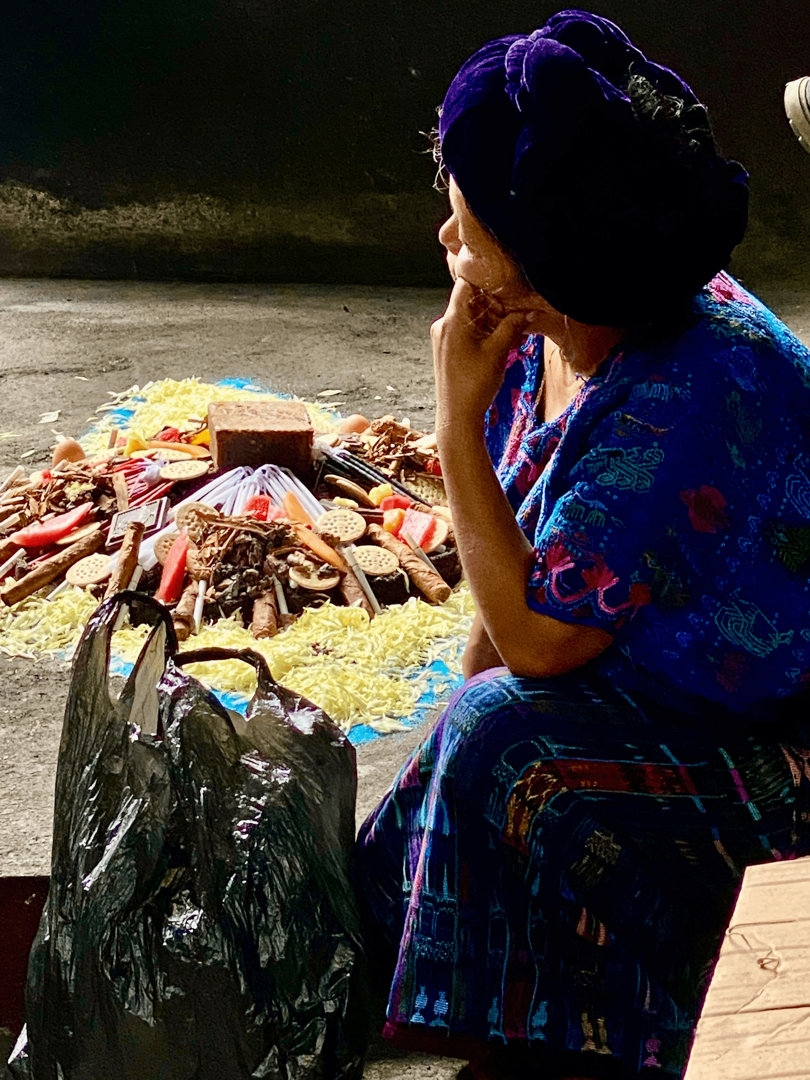 Local mayan woman prepares the offerings for her ceremony.  You can share local culture when visiting Lake Atitlan.