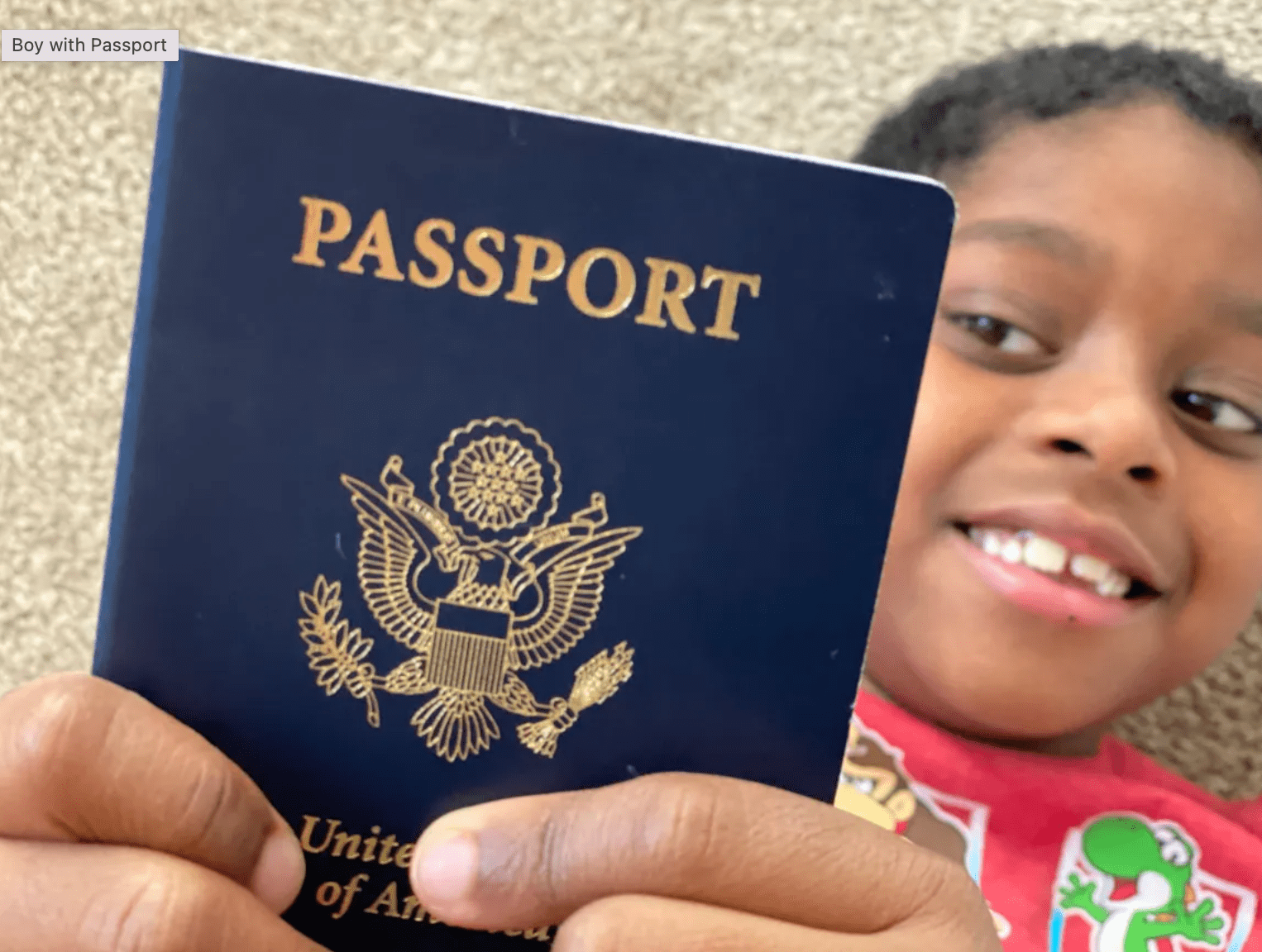 A young child holds his first passport. Passports are required for travel to Guatemala, regardless of age.