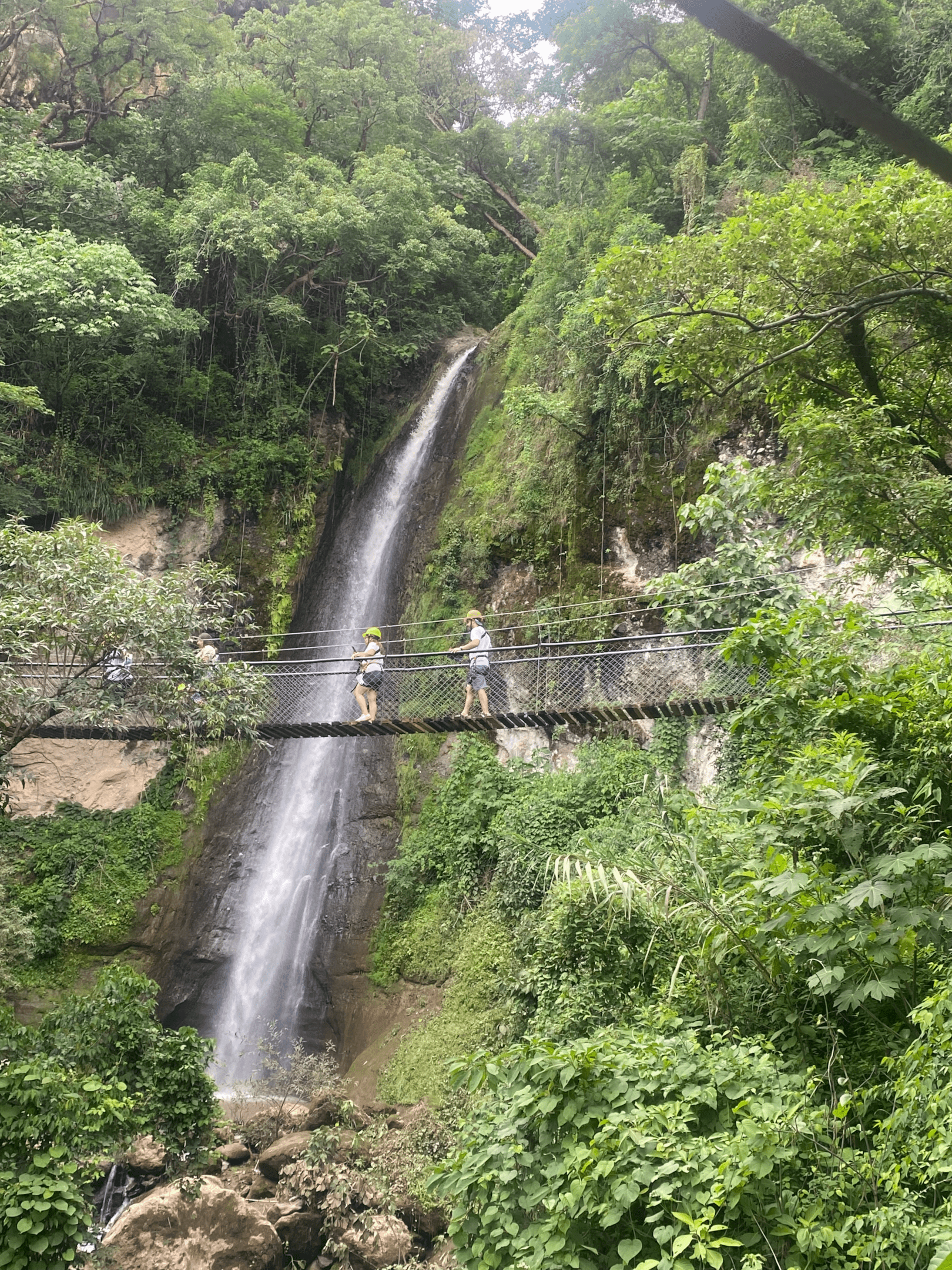 Walking across one of the suspension bridges in front of a waterfall is one of the most beautiful locations in Guatemala..