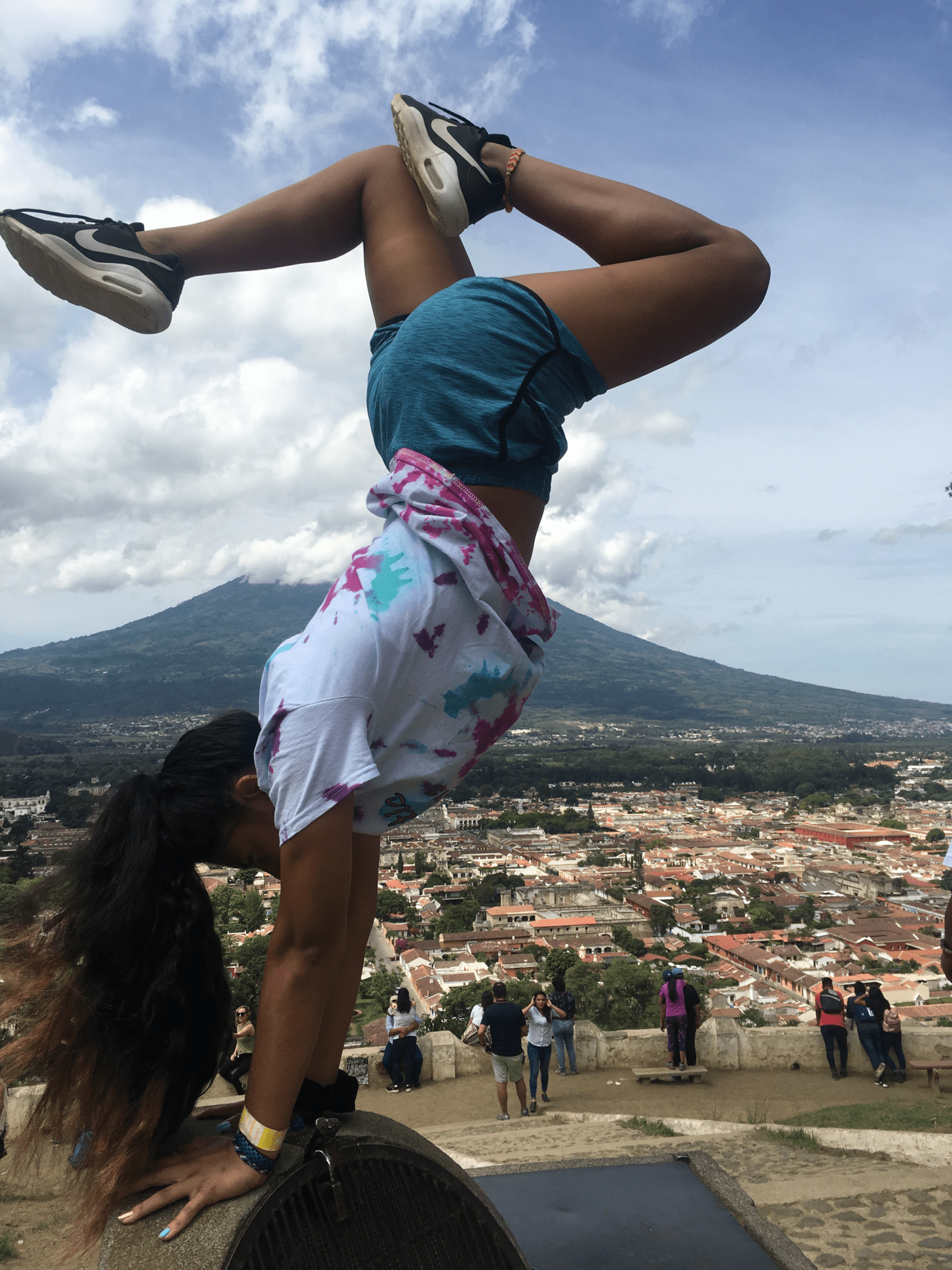 Teen doing handstand at Cerro de la Cruz park.