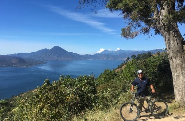 American tourist cycling in Guatemalan highlands