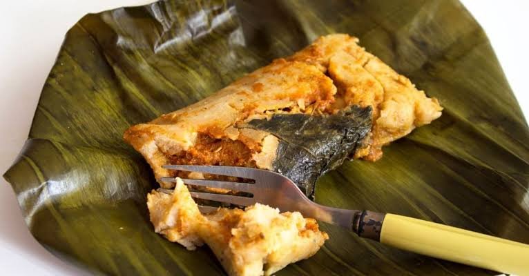 Guatemalan tamales wrapped in banana leaves